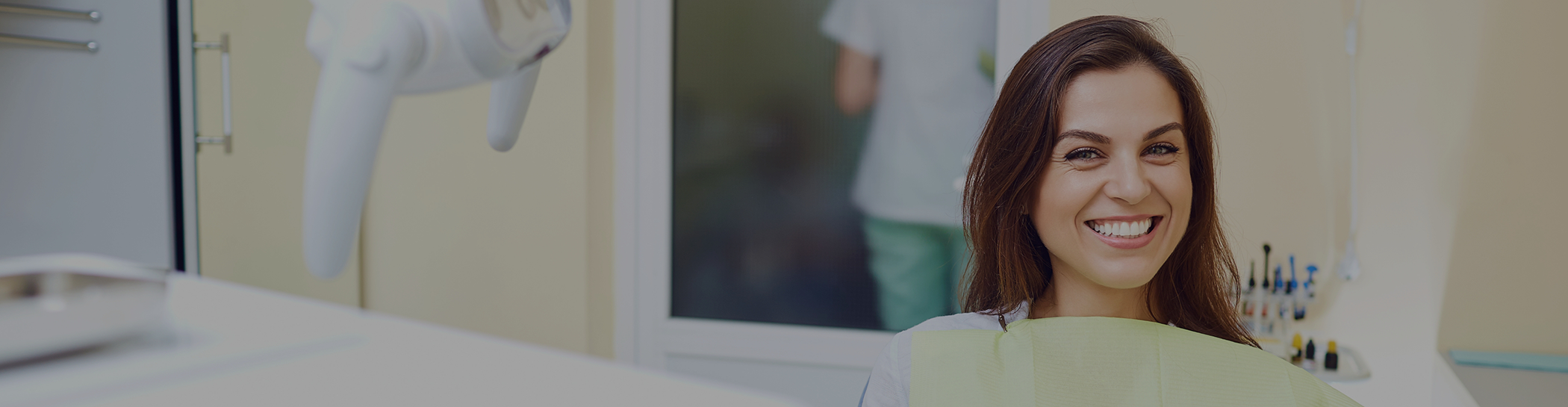 Female patient smiling in dental chair