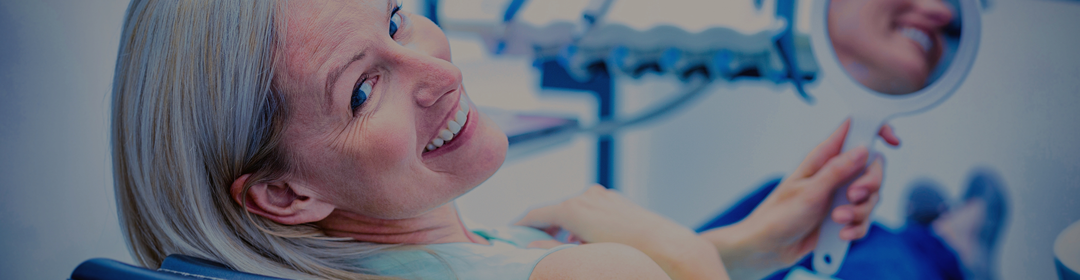 Female patient sitting in dental chair and looking back