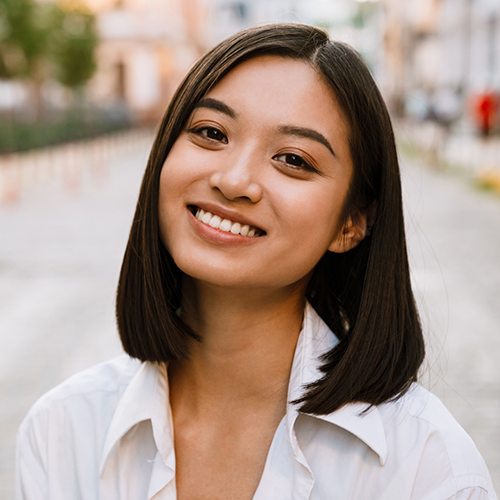 Close up of woman in white shirt smiling