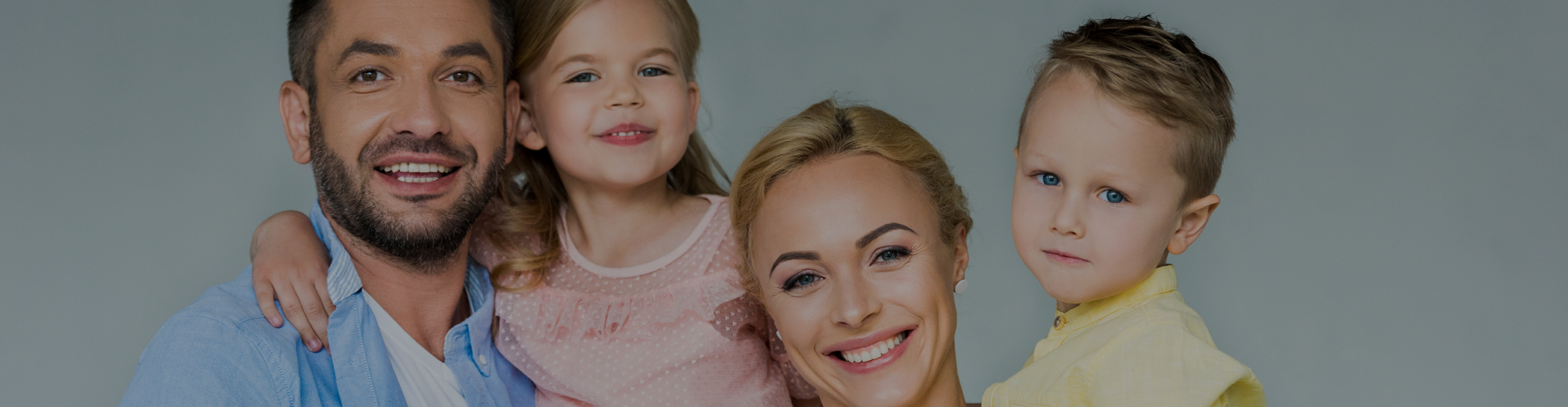 Mother and father holding their children