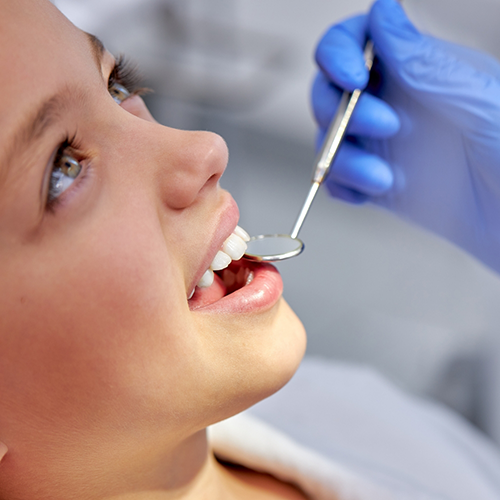 Patient opening mouth for dental exam