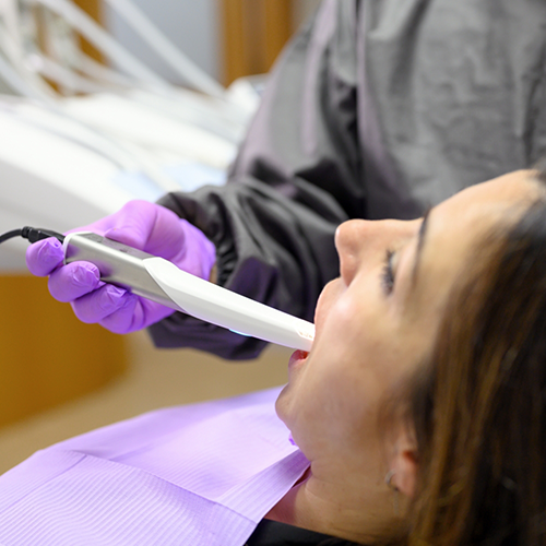 Using intraoral camera to scan patient's teeth