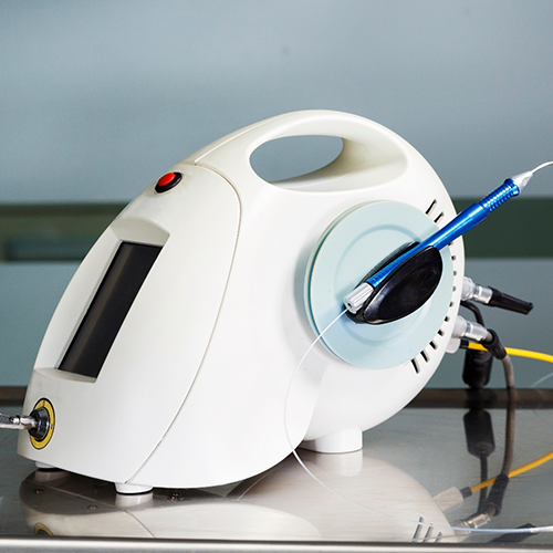 Soft tissue laser attached to machine