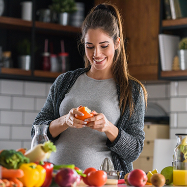 Woman looking at an apple