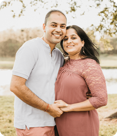 Dr. Mansi Talsania with her husband in front of a lake