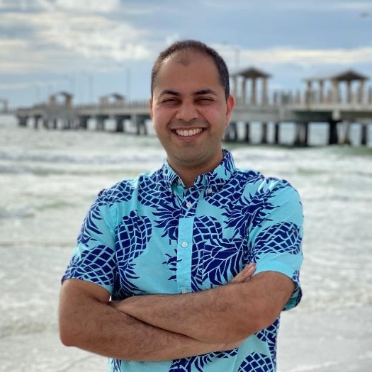 Doctor T wearing floral shirt on the beach