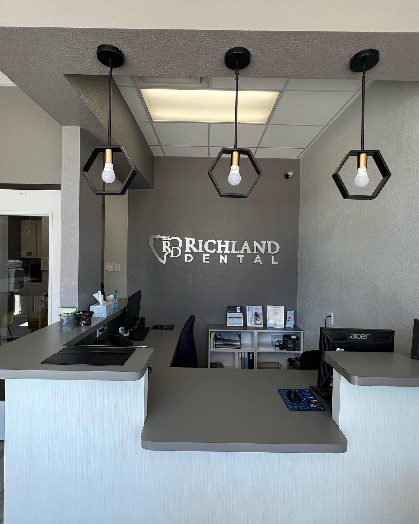 Richland Dental sign on wall of dental office in Richardson Texas