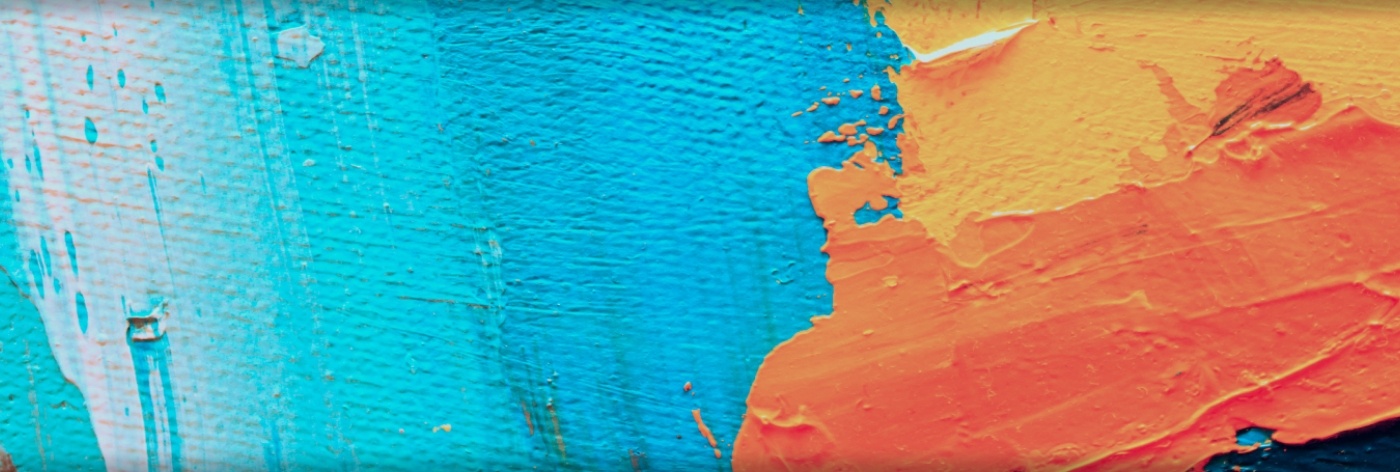 Decorative splashes of orange and blue paint
