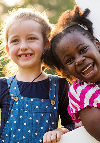 Close up of two little girls smiling