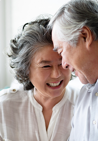 Older man and woman smiling