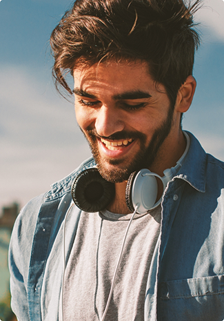 Young man with facial hair smiling