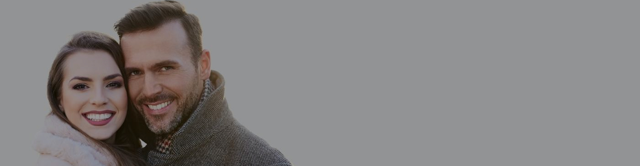 Man and woman hugging outside