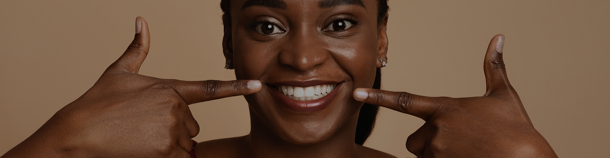 Close up of man pointing to his teeth