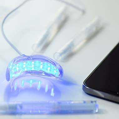 Parts of a take-home teeth whitening kit