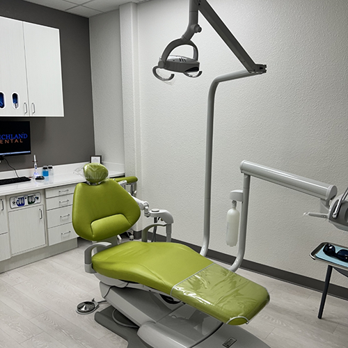 Dental chair with overhead light