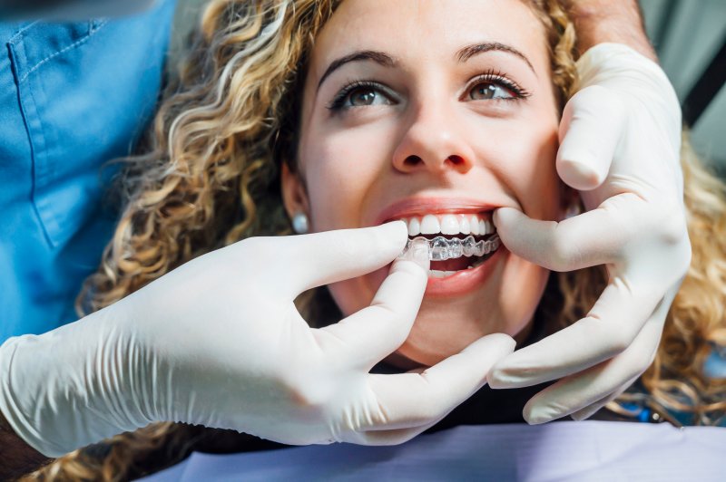 female patient being fitted with Invisalign